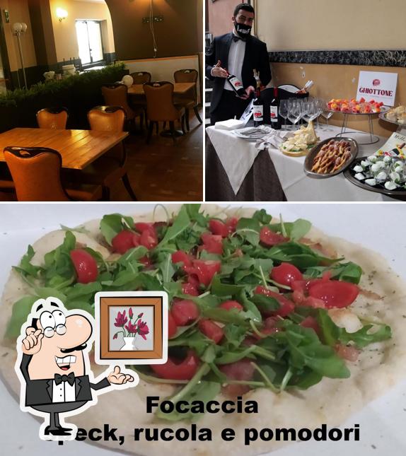 Tra le diverse cose da Pizzeria Dal Ghiottone si possono trovare la interni e cibo