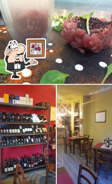 Questa è la immagine che presenta la interni e cibo di Wine Art Rende