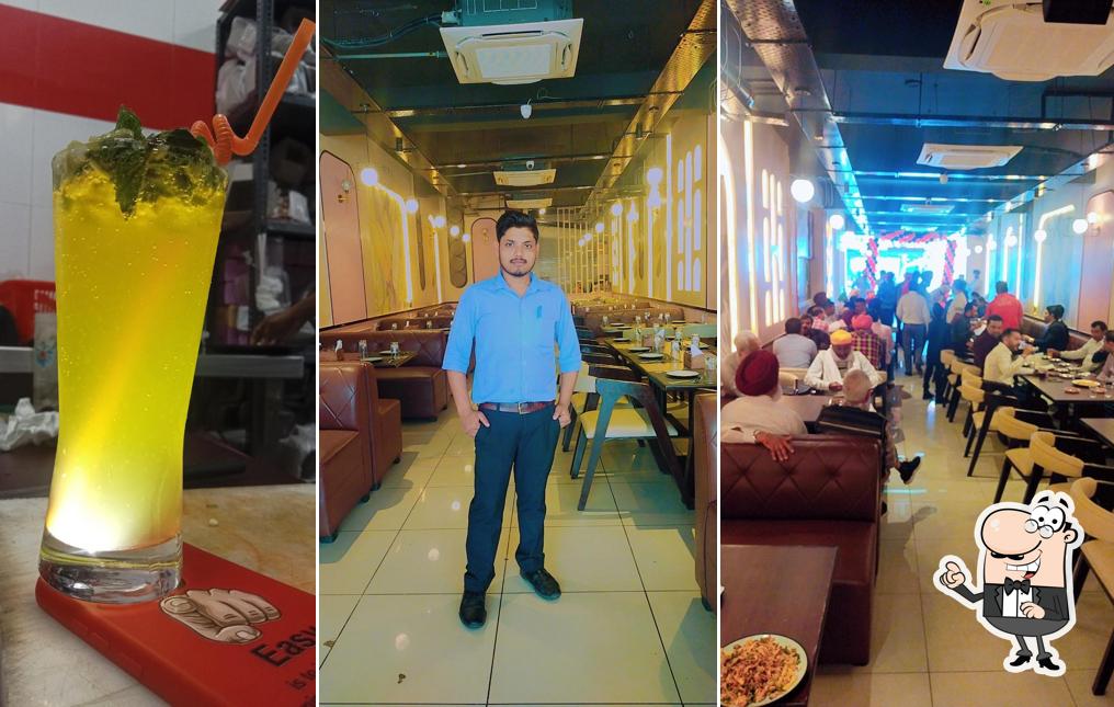 Take a seat at one of the tables at Baba's Veg & Non Veg Restaurant