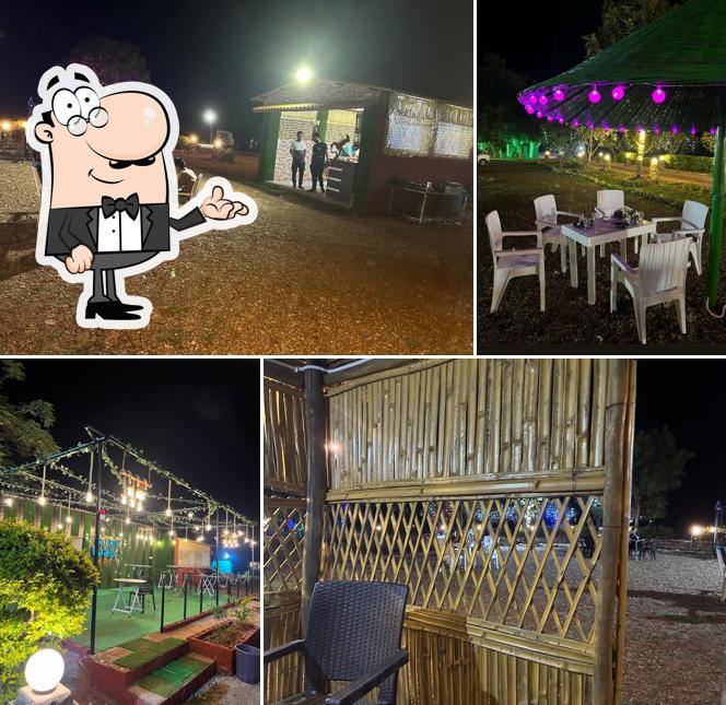 Take a seat at one of the tables at Jungle Safari Resort & Restaurant