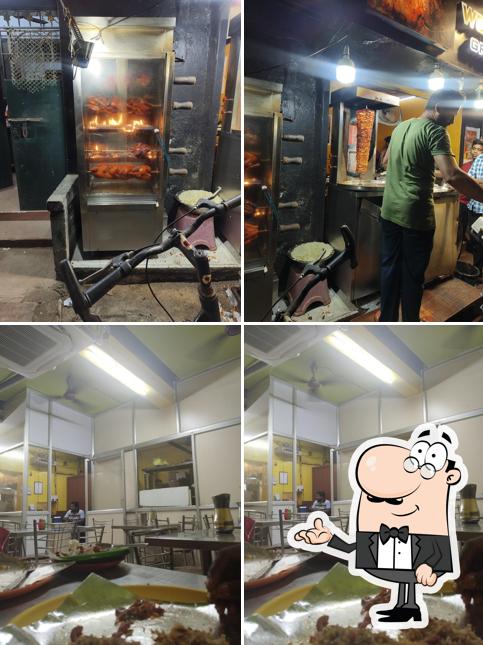 Take a look at the photo showing interior and food at Woodlands Grill And Shawarma House