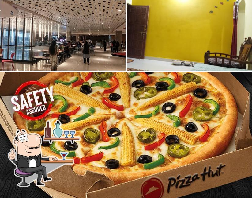 Check out the image showing interior and food at Pizza Hut Tapadia City Centre, Amravati
