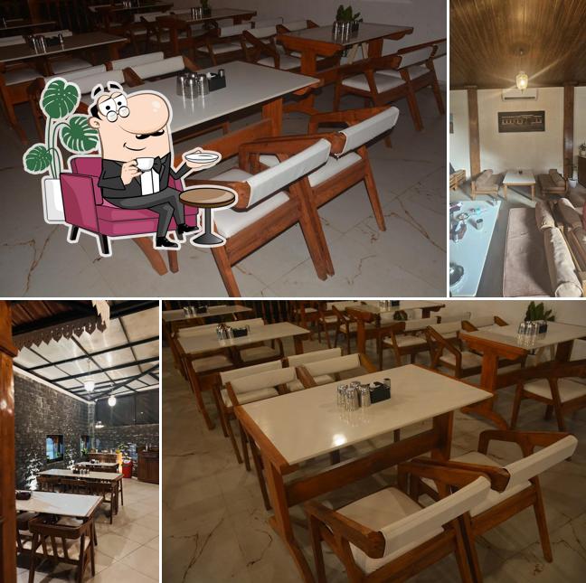 Take a seat at one of the tables at Hotel Chul Mutton Baner - Sagar Takawale Group of Hotels