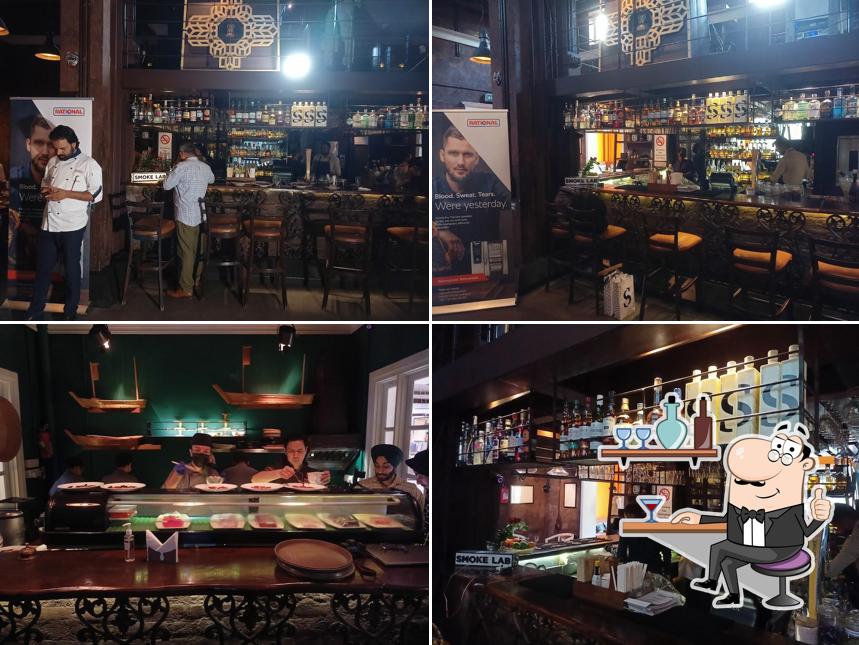 Take a seat at one of the tables at Qlub House by Eleven Course