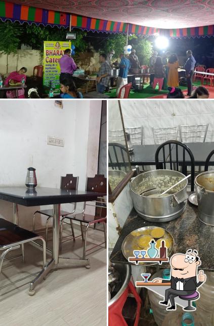 Take a seat at one of the tables at Bharath Restaurant