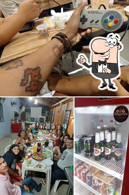 Confira a foto mostrando interior e bebida no Tio Chico: Burguer, Games & MMA