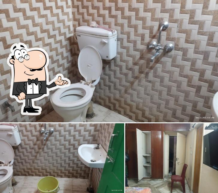 Take a seat at one of the tables at Nirala Saikate - Bengali Guest House Hotels & Lodges in R.K.Beach, Vizag