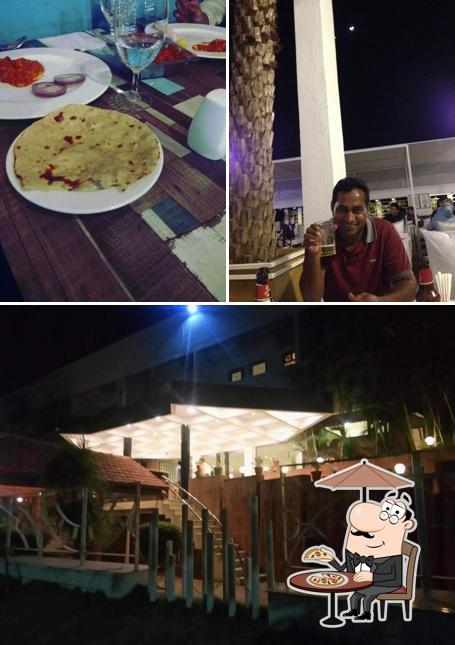 This is the photo showing exterior and dining table at Hotel heritage