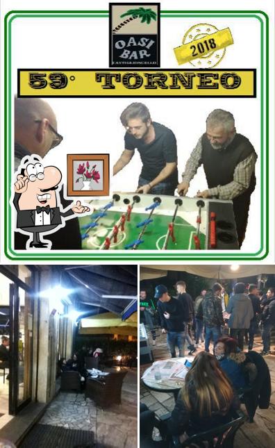Siediti a un tavolo di Oasi Bar