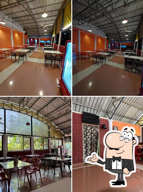 Take a seat at one of the tables at Hotel Narvekar