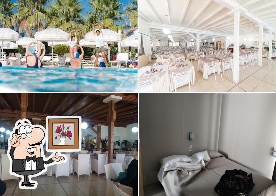 Siediti a un tavolo di Poseidon Resort - Villaggio Vacanze