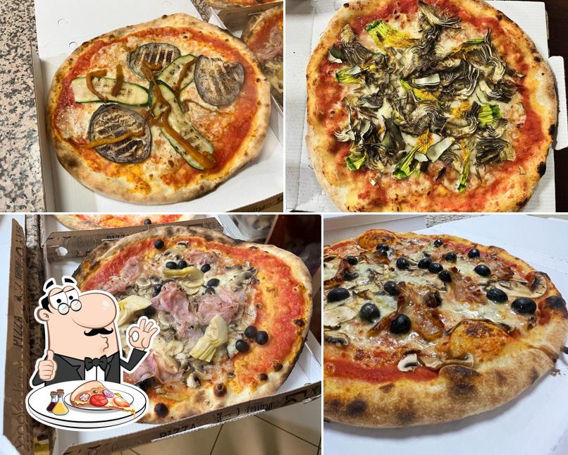 A Pizzeria Al Caminetto, puoi provare una bella pizza