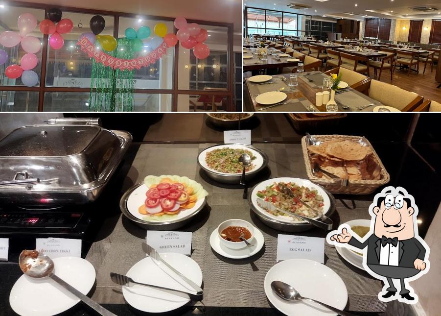 Among different things one can find interior and food at Kabab Souq- A Multi Cuisine Restaurant