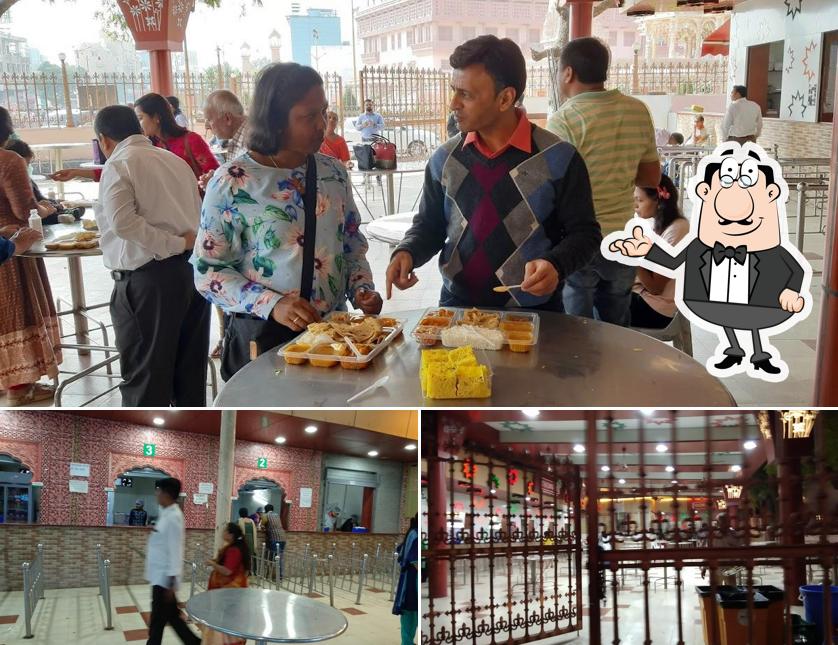 Take a seat at one of the tables at Premvati Uphar Gruh