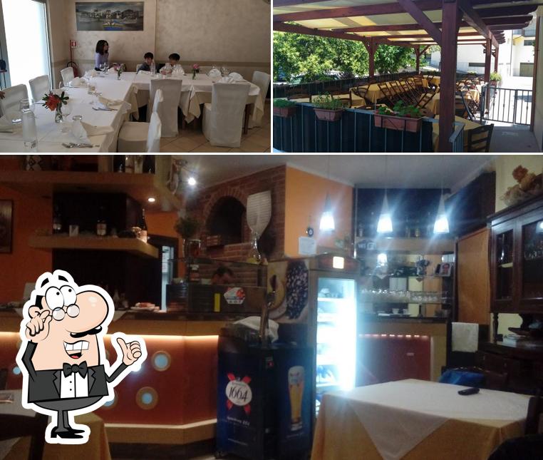 Questa è la immagine che mostra la interni e esterno di Il Girasole Trattoria Pizzeria di Gilberti Franca Pietro & C