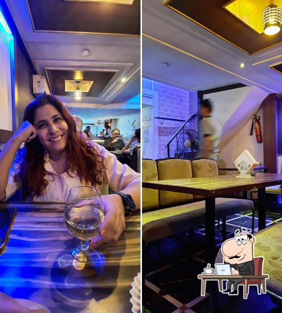 Take a seat at one of the tables at Alfred Restaurant And Bar