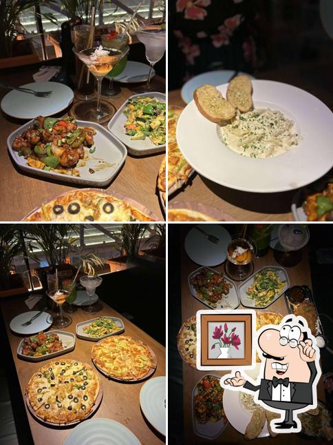 Take a seat at one of the tables at Agent Jack's Bar - Andheri West