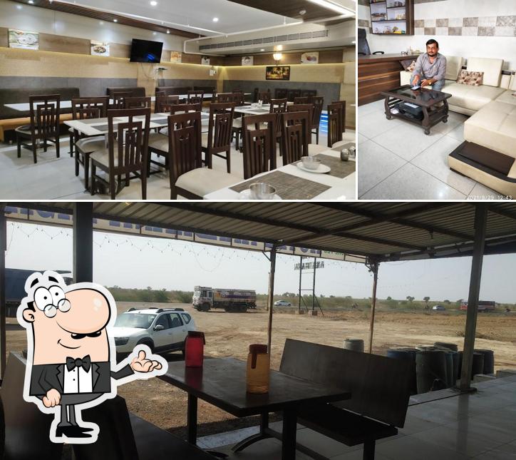 Take a seat at one of the tables at Hotel Aradhana