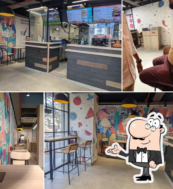 Take a seat at one of the tables at Domino’s Pizza Tilka manjhi, Bhagalpur