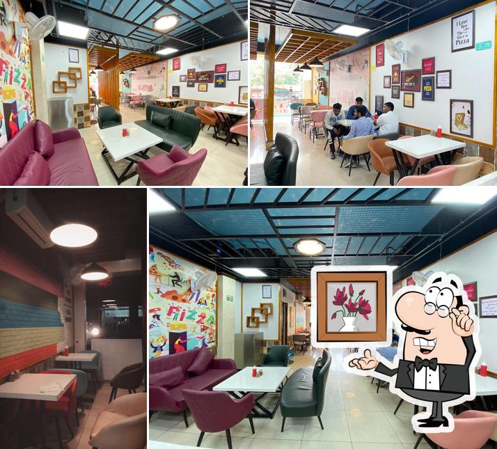 Take a seat at one of the tables at Hungry Point - Phagwara