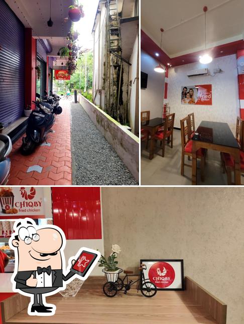 Among different things one can find exterior and interior at Chiqby Fried Chicken Pravinkoodu