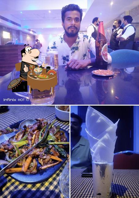 Take a look at the photo depicting food and bar counter at Krishna Bar& Wine