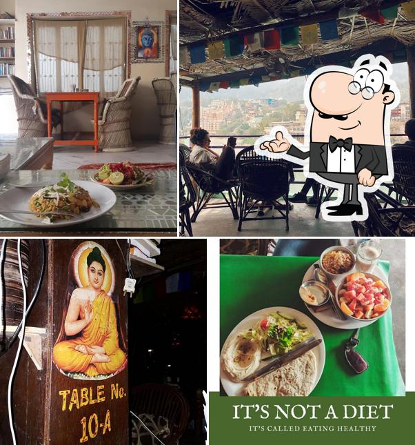Take a seat at one of the tables at Buddha Cafe
