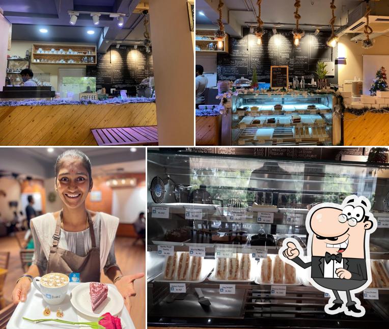 Take a seat at one of the tables at Bean Board - Chinna Waltair