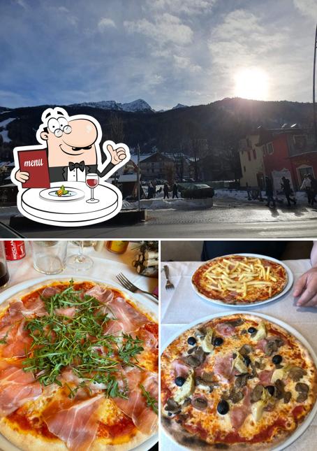Guarda la immagine che presenta la cibo e esterno di Pizzeria