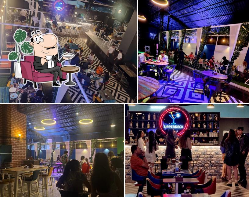 Take a seat at one of the tables at Upper Deck Lounge