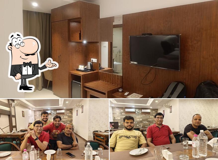 Take a seat at one of the tables at Hotel Rameshwaram