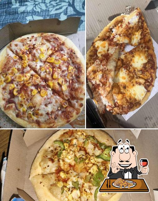 Pick pizza at Domino's Pizza Munirka, New Delhi