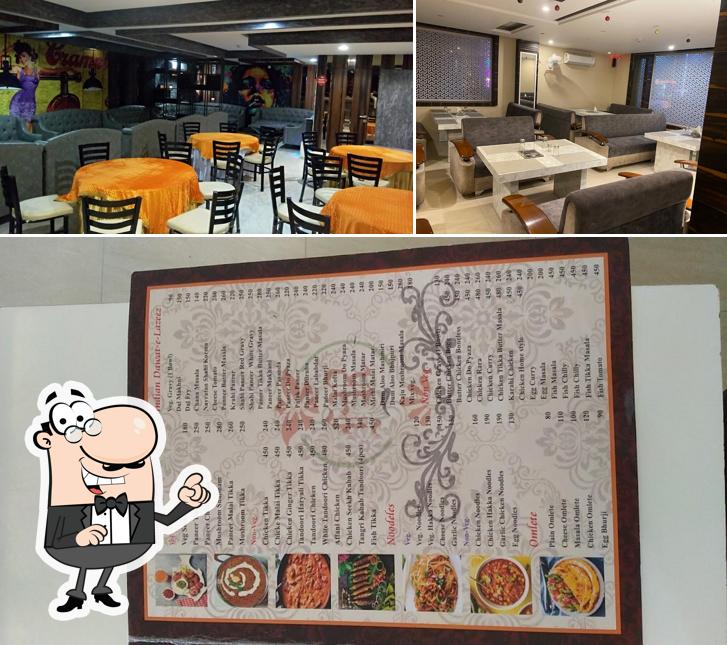 Take a seat at one of the tables at Fortune grill Restaurant