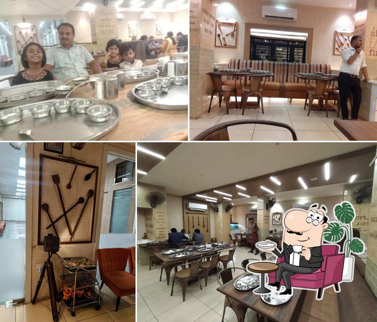 Take a seat at one of the tables at Dadich's Satvik Bhoj