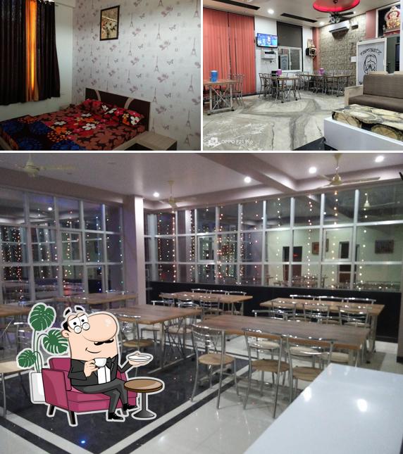 Take a seat at one of the tables at Hotel Tirupati & Restaurant