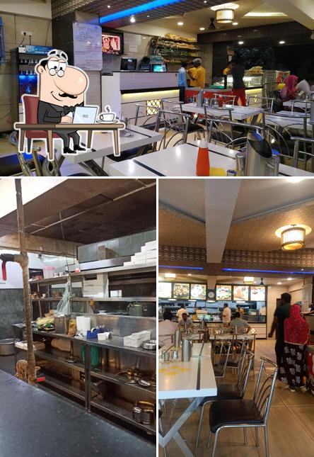 Take a seat at one of the tables at New Udupi Grand