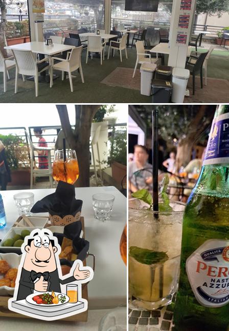 Tra le diverse cose da Bar Il Chiosco Di Guzzon Andrea Snc si possono trovare la cibo e interni