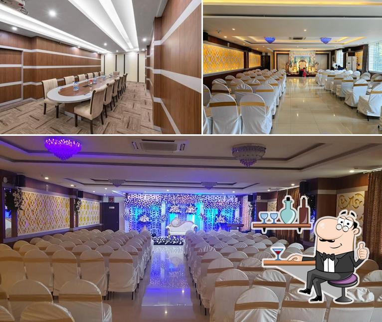 Take a seat at one of the tables at T S Royal Grand Hotel - Chandapura, Bangalore