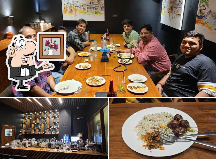 The photo of Magnolia 6 Bar’s interior and food