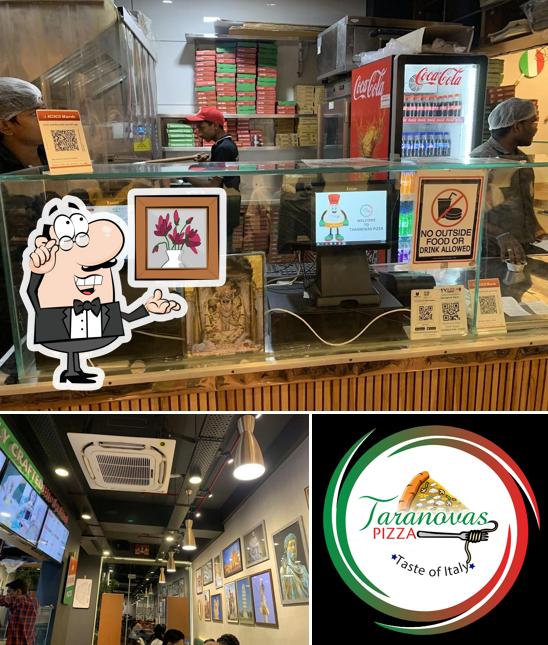 Take a seat at one of the tables at Taranovas Pizza