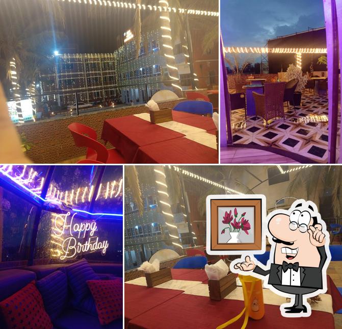Take a seat at one of the tables at Sky Light Rooftop Cafe