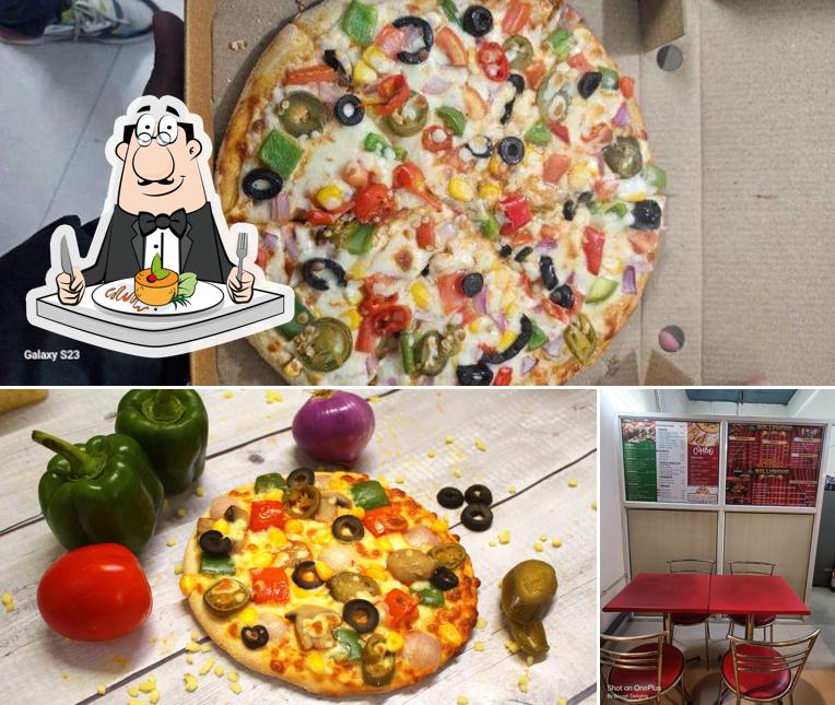 The picture of Dough Delights - Authentic Pizza Restaurant & Delivery’s food and interior