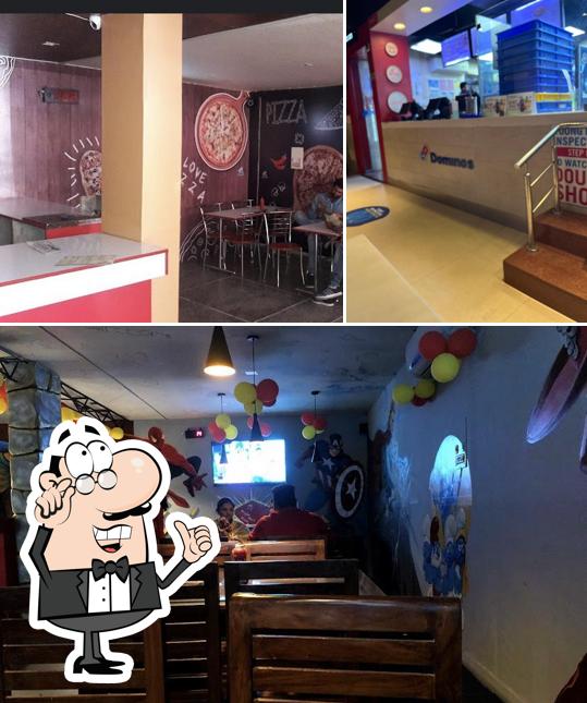 Take a seat at one of the tables at Domino's Pizza Rishi Nagar, Ludhiana