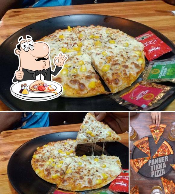 Get pizza at Cafe Dreams