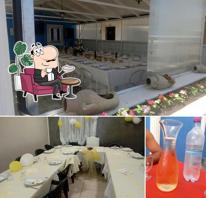 La foto di interni e bevanda da Ristorante L’Angolo dei Golosi