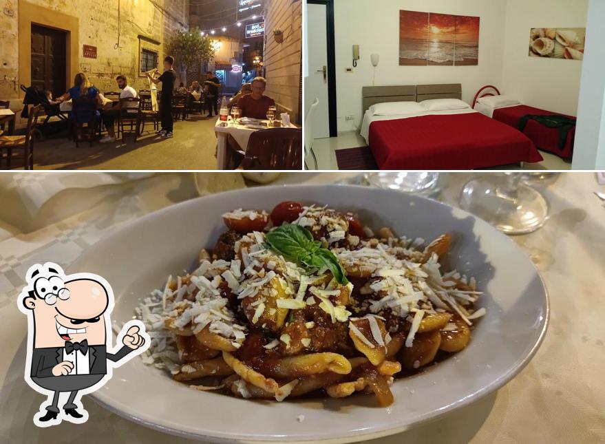 Dai un’occhiata alla immagine che raffigura la interni e cibo di Lanternella Ristorante Pub Pizzeria Beb