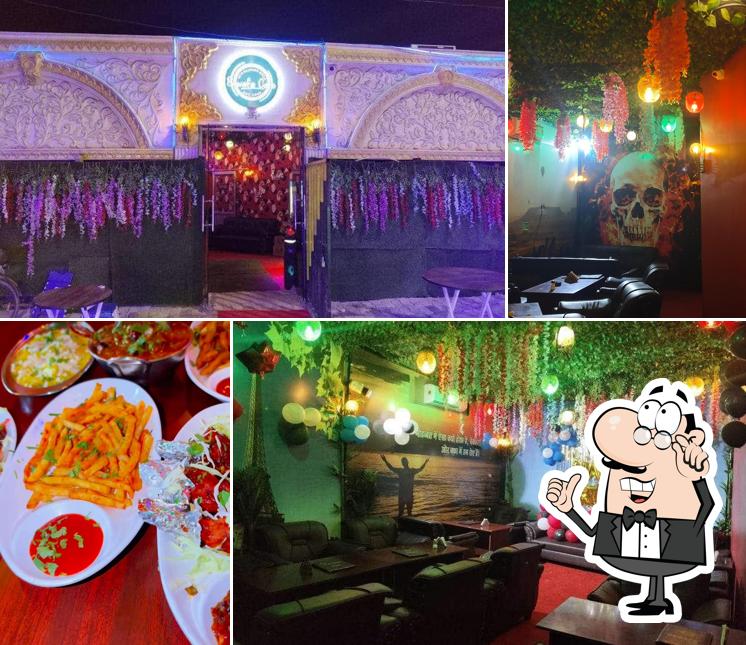 Take a seat at one of the tables at Bewafa Cafe & Restaurent