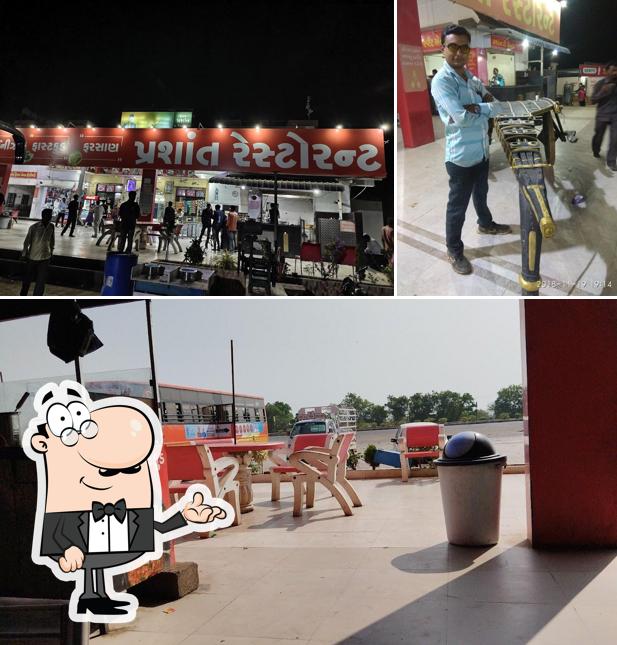 Take a seat at one of the tables at Prashant Hotel