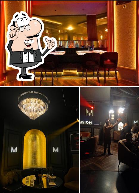 Take a seat at one of the tables at Mansion - Tapas & Club