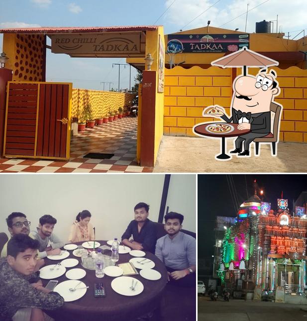 TADKAA FAMILY RESTAURANT is distinguished by exterior and dining table